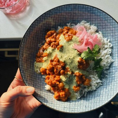 A picture of Butter Cauliflower and Chickpeas with Mint Cilantro Sauce